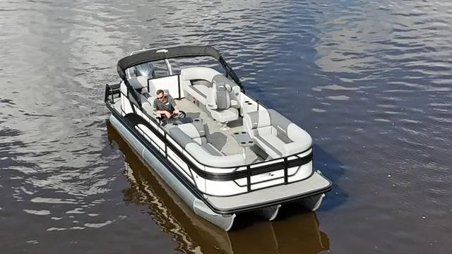Slide: The Image of 2024 Bennington 22 SSR-SPS pontoon boat on calm water, featuring spacious seating and sleek design. - 7