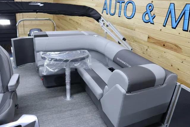Slide: The Image of 2024 Bennington 22 SVL pontoon boat with gray seating and a small table. - 12