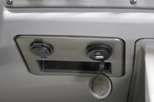 Slide: The Image of 2024 Bennington 22 SVL dashboard with USB and 12V power outlets. - 21