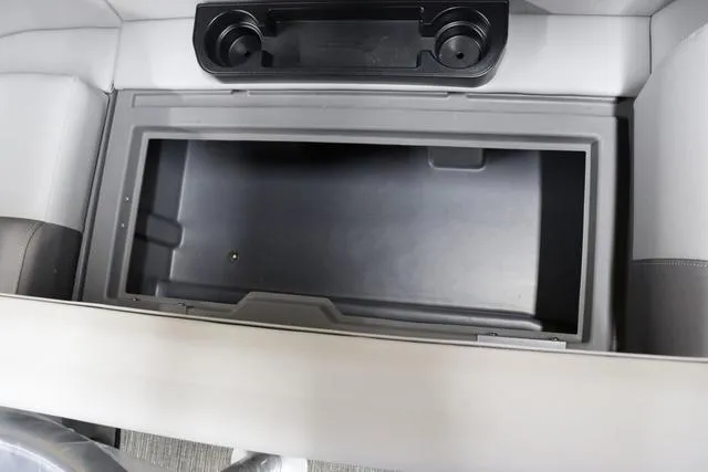 Slide: The Image of Interior storage compartment of 2024 Bennington 22 SVL boat with cup holders. - 22