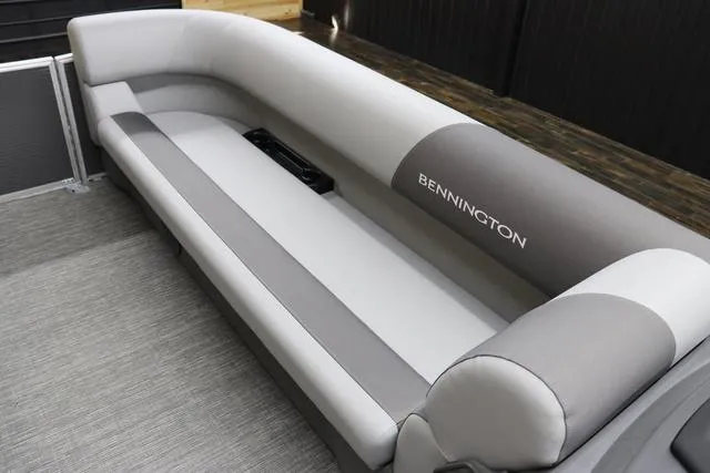 Slide: The Image of 2024 Bennington 22 SVL boat interior with gray and white seating. - 25