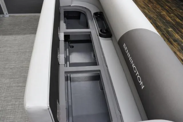 Slide: The Image of 2024 Bennington 22 SVL boat interior storage compartments and seating area. - 26