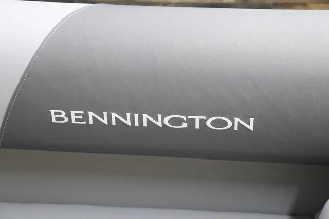 Slide: The Image of 2024 Bennington 22 SVL boat seat with logo, featuring gray upholstery. - 31