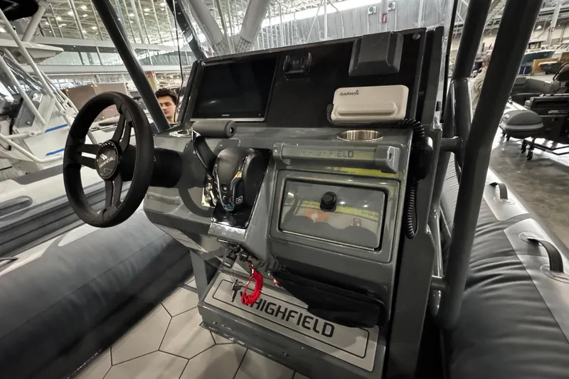 Slide: The Image of 2026 Highfield Sport 660 boat, underside view with speaker and railing details. - 11