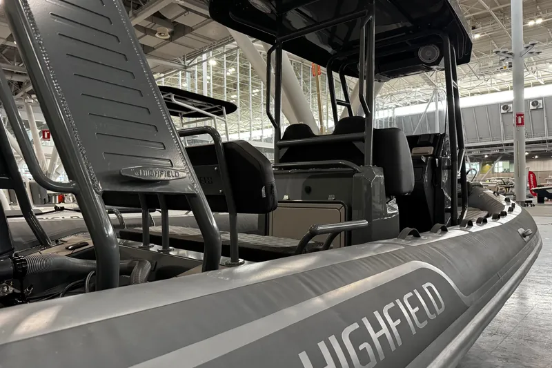 Slide: The Image of 2026 Highfield Sport 660 boat with Yamaha engine displayed indoors. - 14