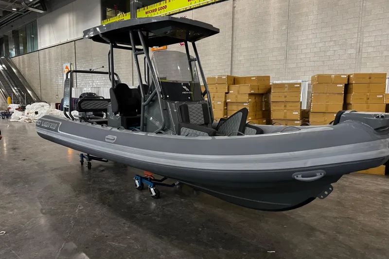 Slide: The Image of 2026 Highfield Sport 660 boat with sleek design and cushioned seating. - 5