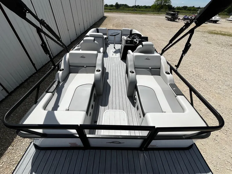 Slide: The Image of 2025 SunCatcher Select 322SS pontoon boat with spacious seating and modern design. - 11