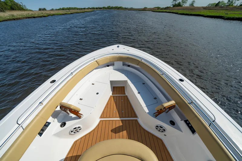 Slide: The Image of 2024 Sportsman Open 352 Center Console boat on a serene river. - 17