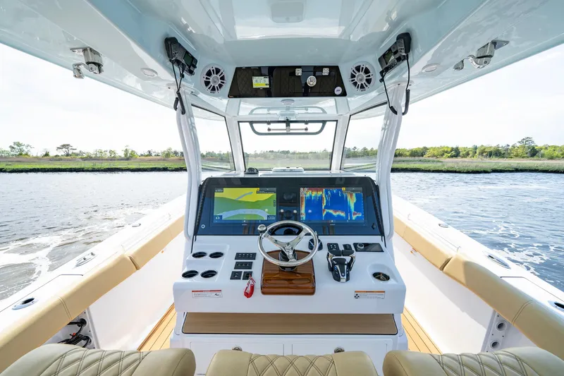 Slide: The Image of 2024 Sportsman Open 352 Center Console boat interior with advanced navigation system. - 21