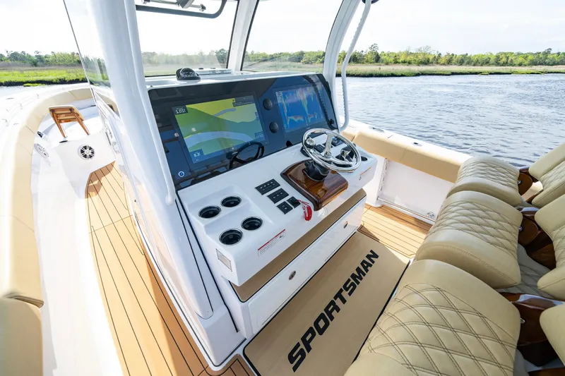 Slide: The Image of 2024 Sportsman Open 352 Center Console boat interior with advanced navigation system and luxurious seating. - 22