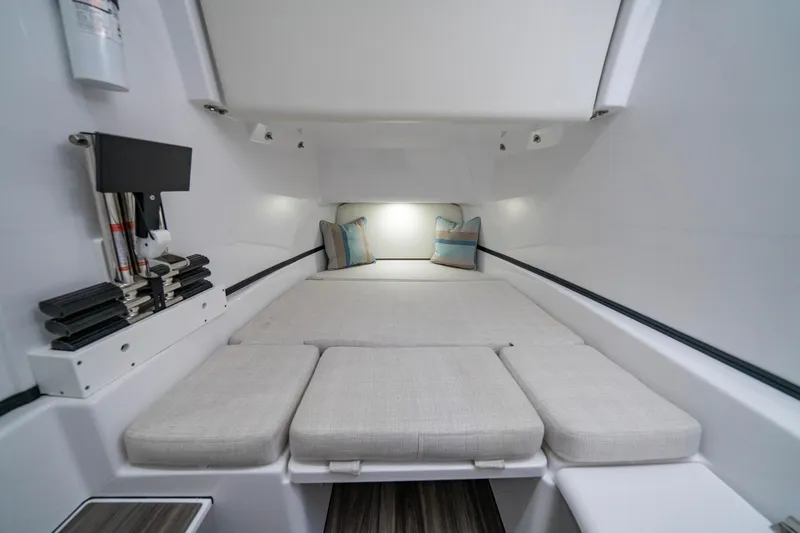 Slide: The Image of 2024 Sportsman Open 352 Center Console cabin interior with cushioned seating and modern design. - 31