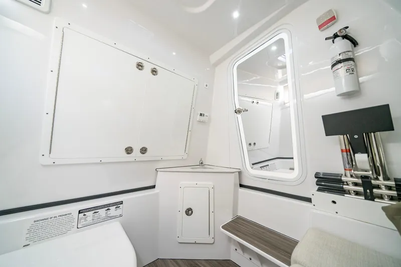 Slide: The Image of 2024 Sportsman Open 352 Center Console interior with modern amenities and safety features. - 33