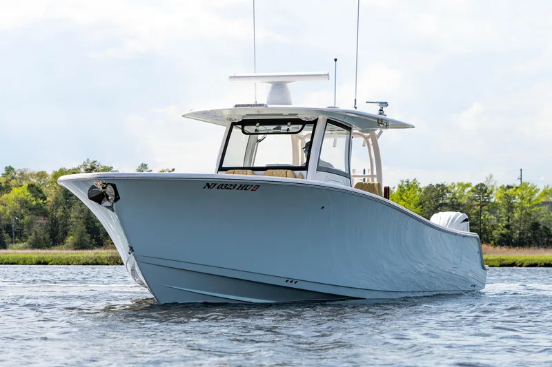 Slide: The Image of 2024 Sportsman Open 352 Center Console boat on water, showcasing sleek design and modern features. - 5