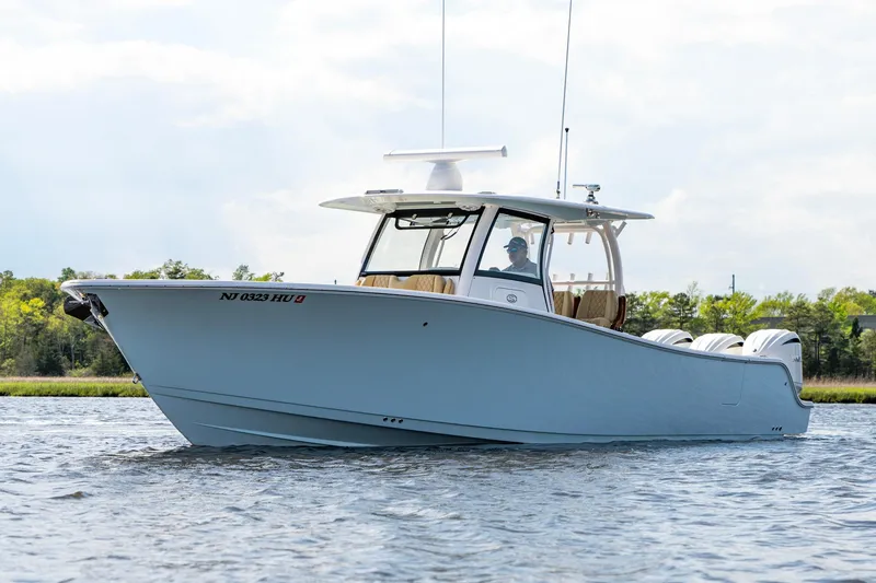 Slide: The Image of 2024 Sportsman Open 352 Center Console boat cruising on water. - 6