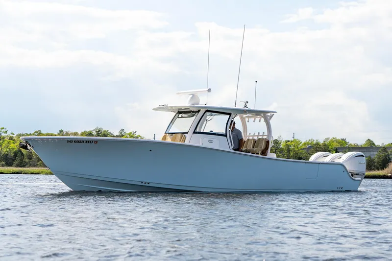 Slide: The Image of 2024 Sportsman Open 352 Center Console boat on calm water. - 7