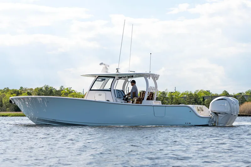 Slide: The Image of 2024 Sportsman Open 352 Center Console boat on water, side view. - 9