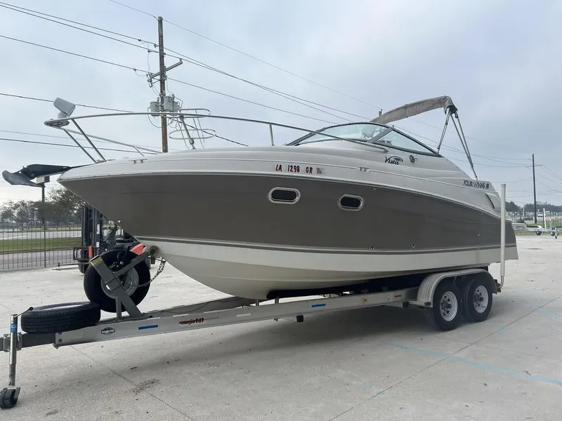 Slide: The Image of 2004 Four Winns 248 Vista boat on trailer, parked outdoors. - 5