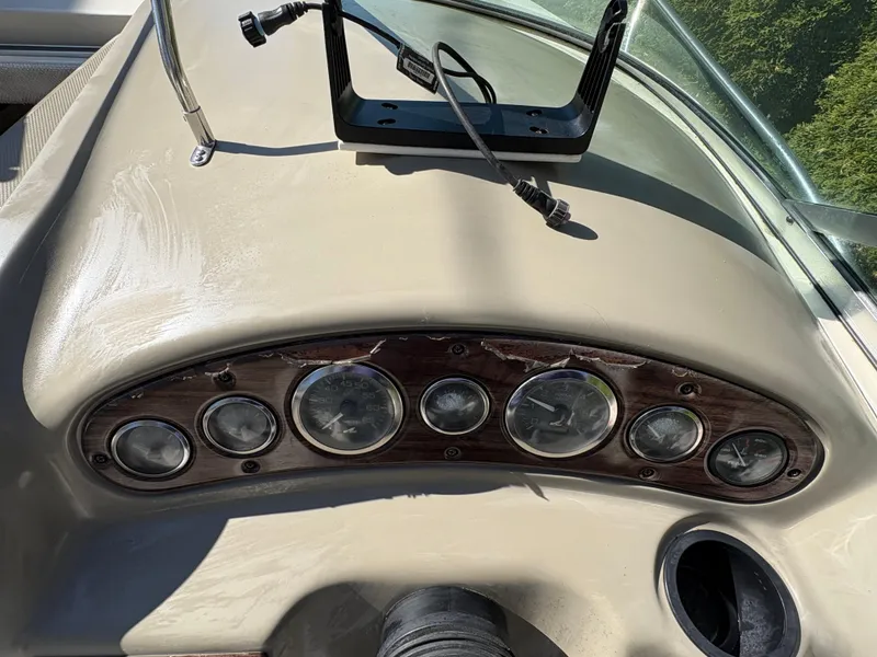 Slide: The Image of Dashboard of 2007 Sea Ray 215 Weekender boat with gauges and controls. - 14