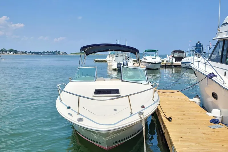Slide: The Image of 2007 Sea Ray 215 Weekender docked at marina on a sunny day. - 2