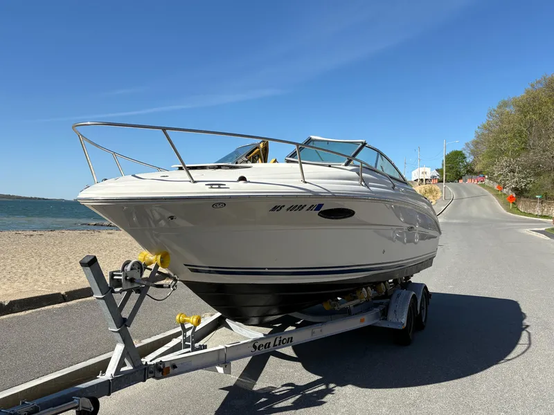 Slide: The Image of 2007 Sea Ray 215 Weekender boat on trailer by the beach road. - 4