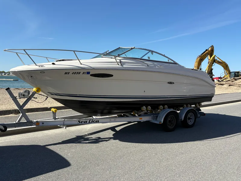 Slide: The Image of 2007 Sea Ray 215 Weekender boat on trailer, parked on a sunny day. - 5
