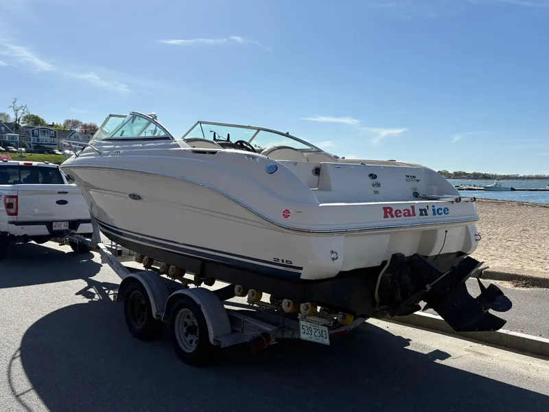 Slide: The Image of 2007 Sea Ray 215 Weekender boat on trailer by the beach. - 7