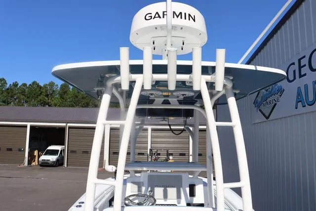 Slide: The Image of 2025 Yellowfin 26 Hybrid boat with Garmin radar, docked near a marine facility. - 12