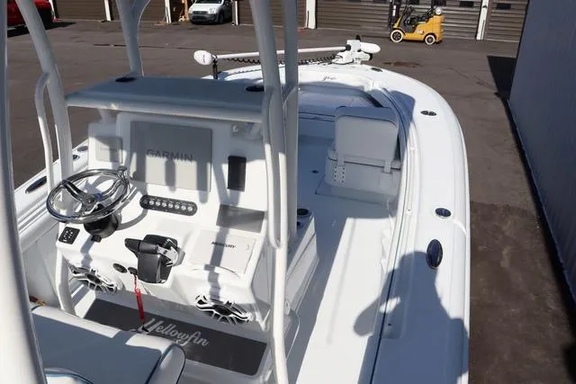 Slide: The Image of 2025 Yellowfin 26 Hybrid boat with Garmin electronics, docked in a marina. - 14