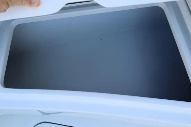 Slide: The Image of Open storage compartment on 2025 Yellowfin 26 Hybrid boat. - 23