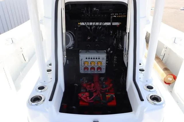 Slide: The Image of 2025 Yellowfin 26 Hybrid boat engine compartment with control panel and wiring. - 25