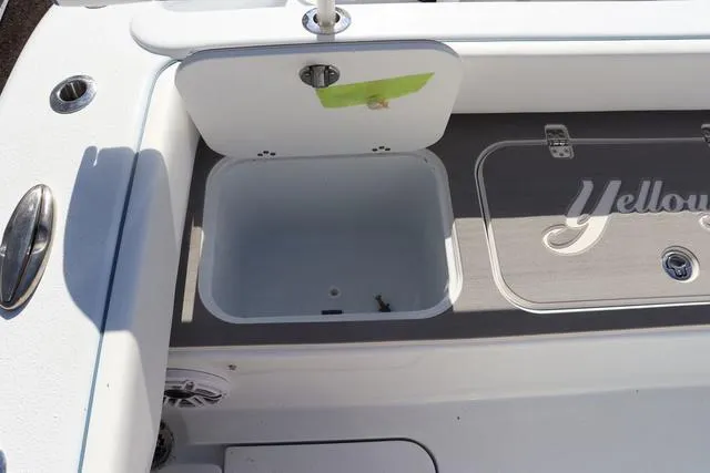 Slide: The Image of 2025 Yellowfin 26 Hybrid boat interior with open storage compartment. - 30
