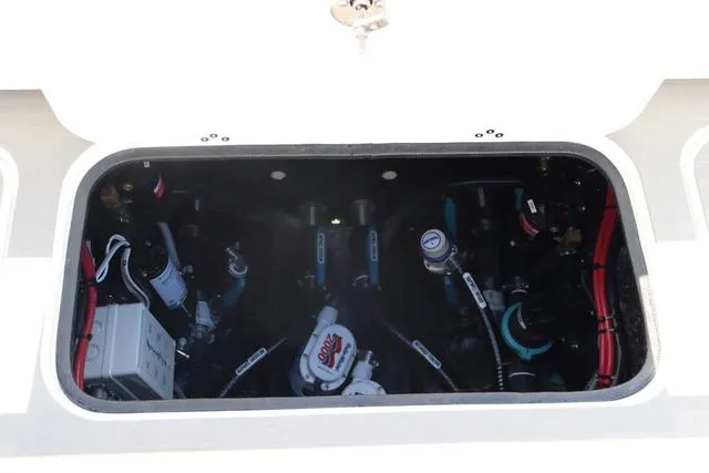 Slide: The Image of Engine compartment of 2025 Yellowfin 26 Hybrid boat, showcasing mechanical components and wiring. - 31