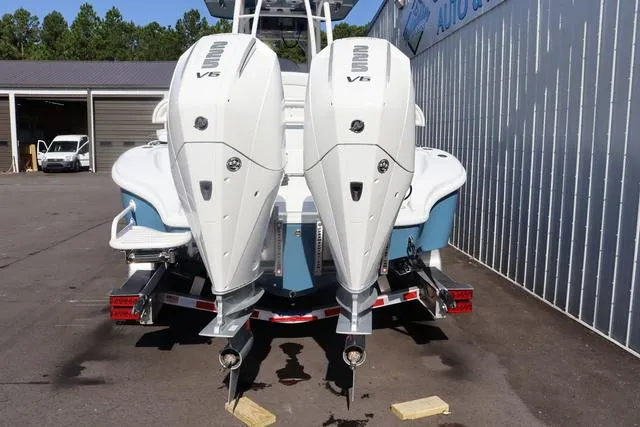Slide: The Image of 2025 Yellowfin 26 Hybrid boat with dual V6 engines on a trailer. - 36