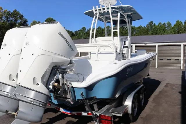 Slide: The Image of 2025 Yellowfin 26 Hybrid boat with dual Mercury engines on a trailer. - 4
