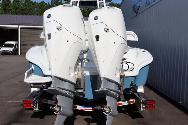 Slide: The Image of 2025 Yellowfin 26 Hybrid boat with dual outboard engines on a trailer. - 5
