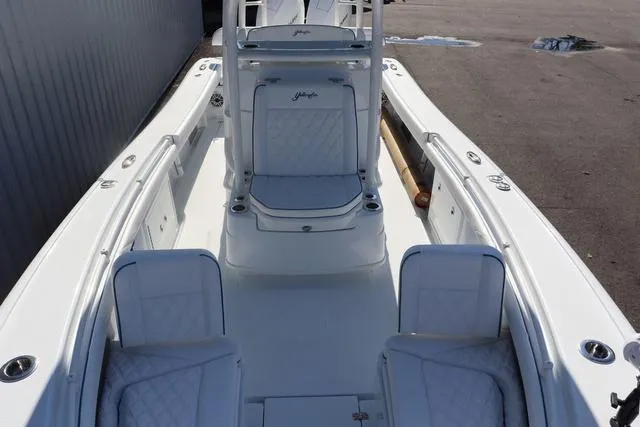 Slide: The Image of 2025 Yellowfin 26 Hybrid boat with white seating and sleek design. - 8