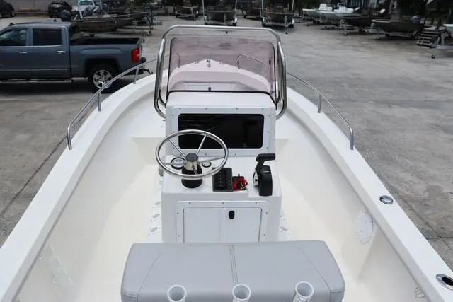 Slide: The Image of 2023 May-Craft 1900 CC boat with center console and steering wheel, parked on concrete. - 18