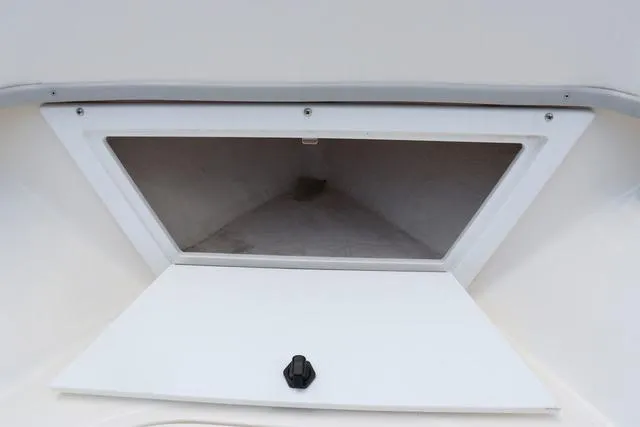 Slide: The Image of 2023 May-Craft 1900 CC boat storage compartment with open hatch. - 29