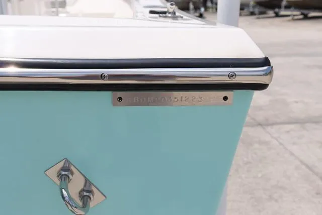 Slide: The Image of 2023 May-Craft 1900 CC boat with light blue hull and stainless steel fittings. - 32