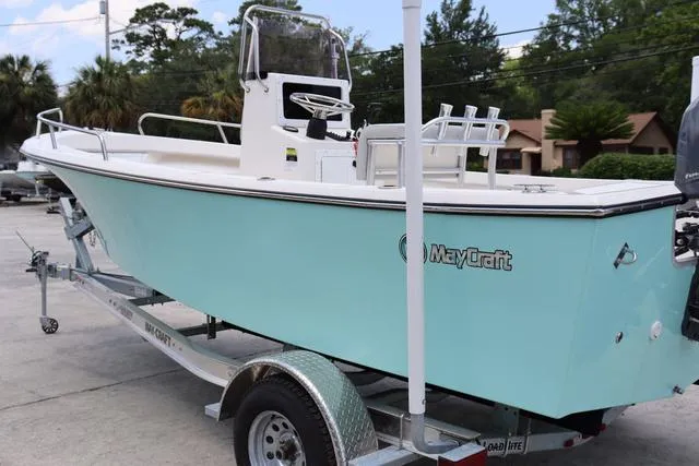 Slide: The Image of 2023 May-Craft 1900 CC boat on trailer, light blue hull, outdoor setting. - 5