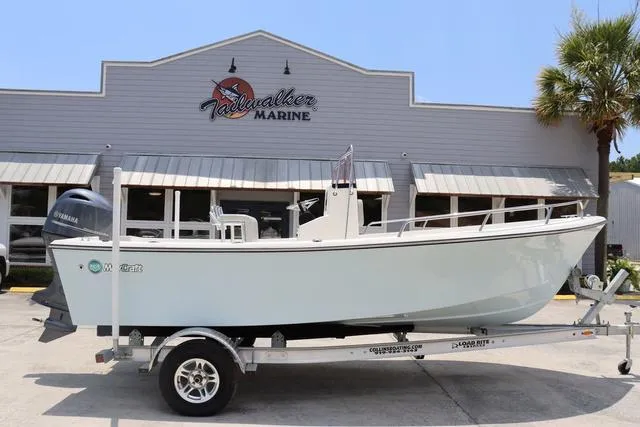 Slide: The Image of 2023 May-Craft 1900 CC boat on trailer outside dealership. - 1