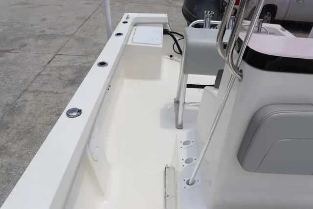 Slide: The Image of 2023 May-Craft 1900 CC boat interior with seating and console, showcasing sleek design. - 11