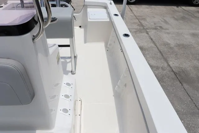 Slide: The Image of 2023 May-Craft 1900 CC boat interior, featuring a clean deck and seating area. - 12