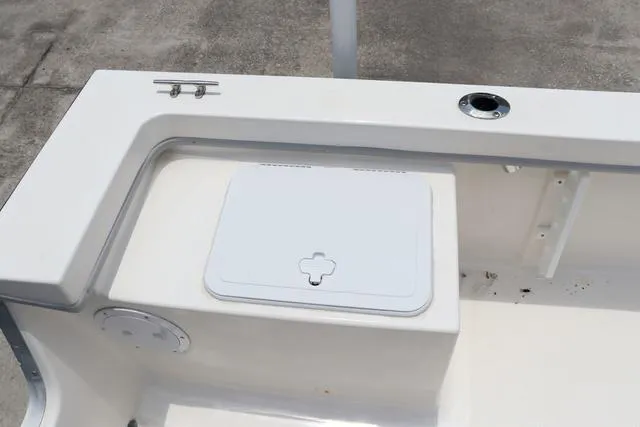 Slide: The Image of 2023 May-Craft 1900 CC boat interior with storage compartment and rod holder. - 15