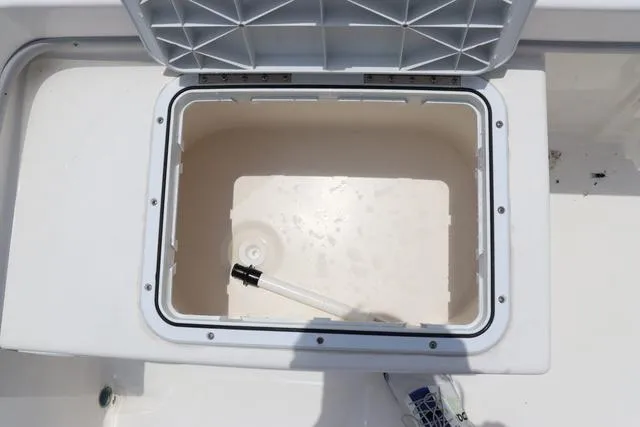 Slide: The Image of Open storage compartment on 2023 May-Craft 1900 CC boat. - 16