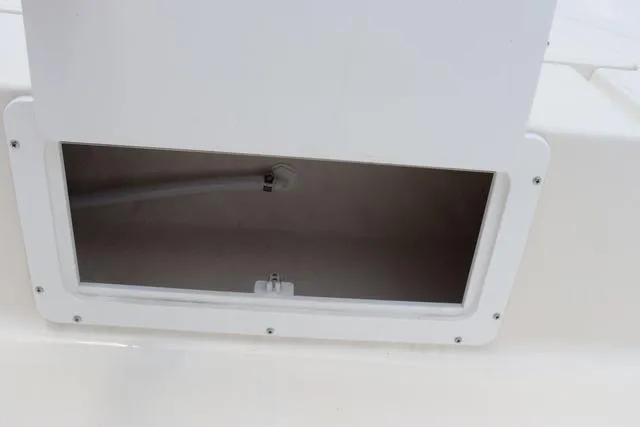 Slide: The Image of Open storage compartment on 2023 May-Craft 1900 CC boat. - 26