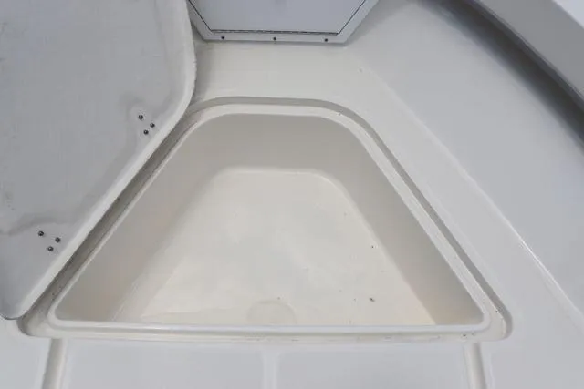 Slide: The Image of Open storage compartment on 2023 May-Craft 1900 CC boat. - 28