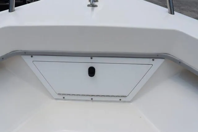 Slide: The Image of 2023 May-Craft 1900 CC boat storage compartment, white interior, close-up view. - 29