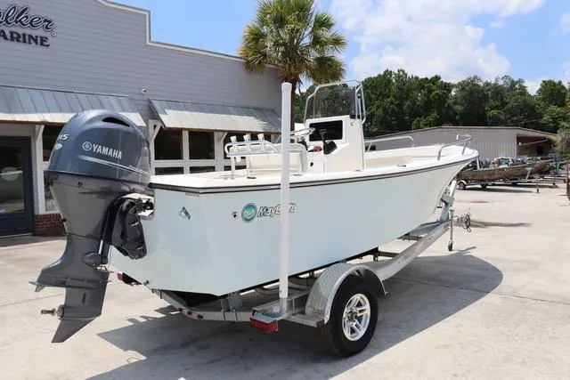 Slide: The Image of 2023 May-Craft 1900 CC boat on trailer with Yamaha outboard motor, parked outdoors. - 3