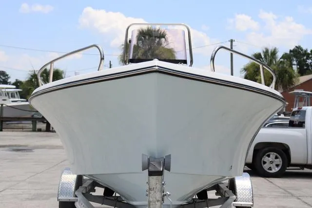 Slide: The Image of 2023 May-Craft 1900 CC boat on trailer, front view, outdoors. - 7